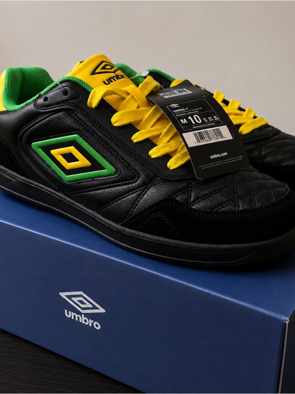Umbro Men's Black Athletic Shoes with Yellow Laces and Green Trim